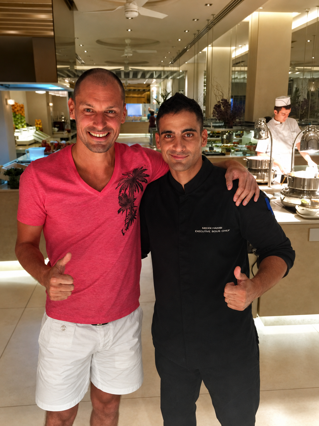 Chef Mehdi with a professional footballer guest in a restaurant